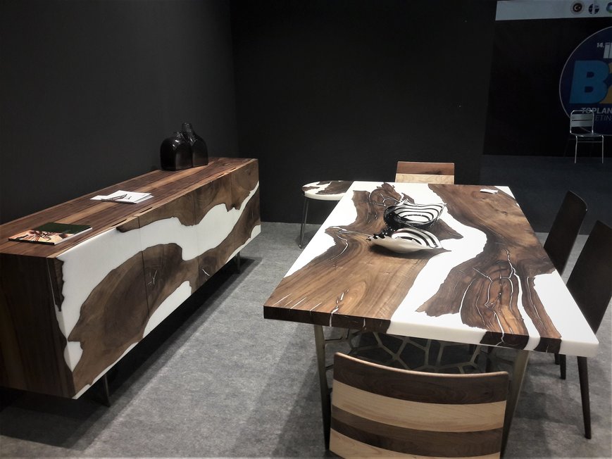 Resin poured wood table .