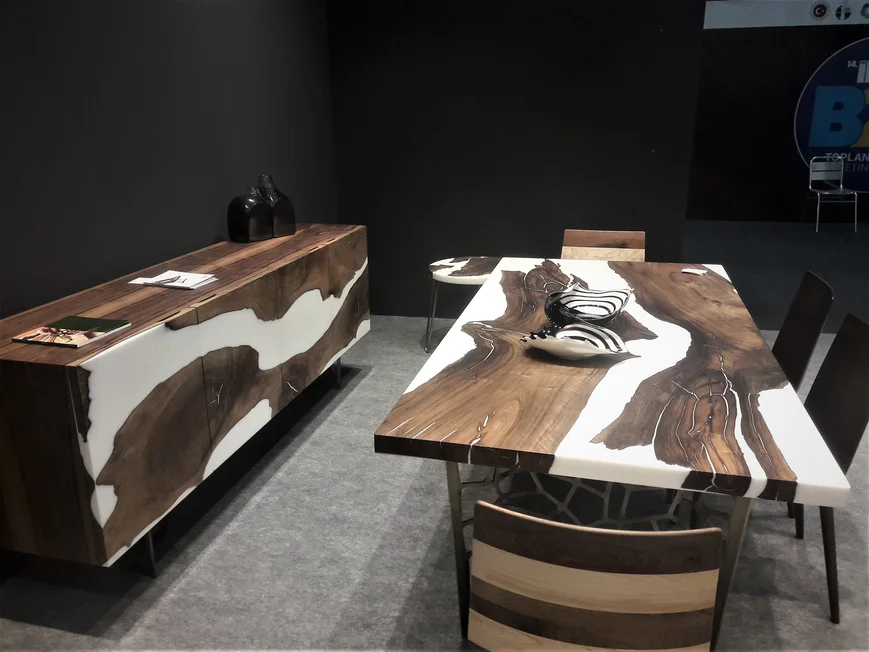 Resin poured wood table .